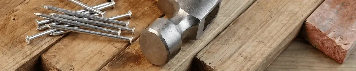 Hammer and nails on hardwood flooring boards in Columbus, OH