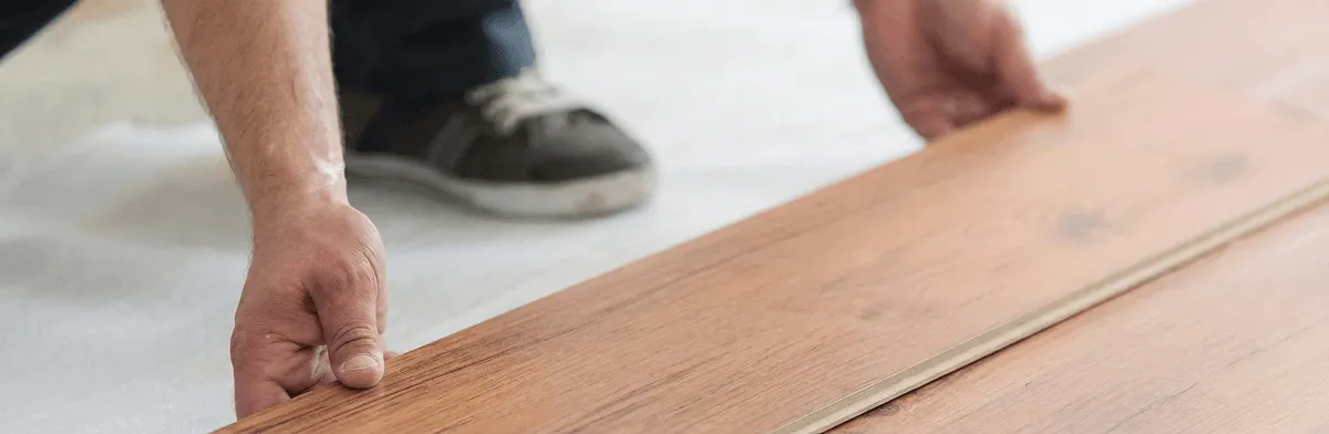 A professional installing laminate flooring in Columbus, OH