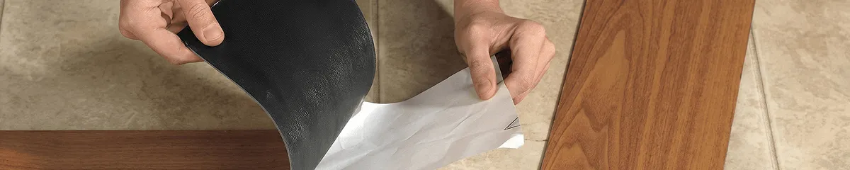 A professional installing vinyl flooring in Columbus, OH