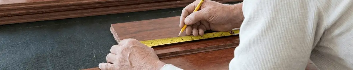 A professional installing wood flooring in Columbus, OH