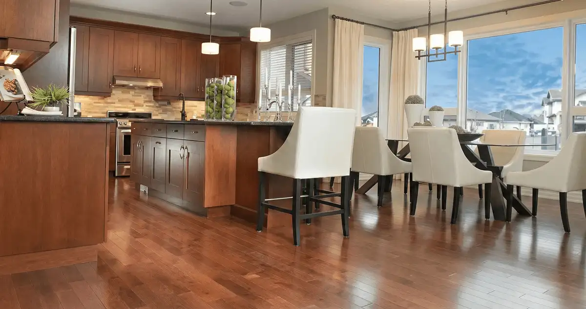 A modern kitchen with professionally installed wood flooring in Columbus, OH